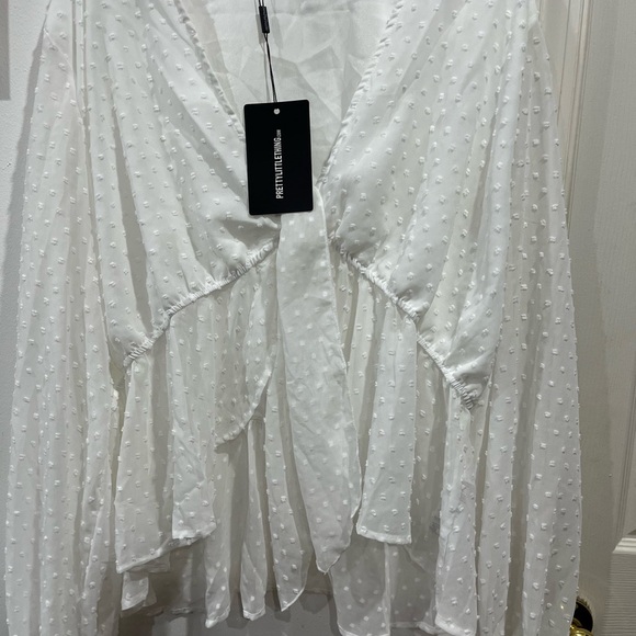 Pretty little things white top size 24
G-2 - Picture 4 of 7